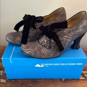 John Fluevog Elisa-Betta Scallop Edge Heel. Brown Patterned Heels with Black Bow